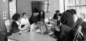 boardroom of business people discussing new technology investment and how to prevent scope creep and stop scope seep