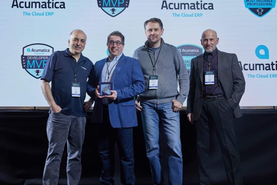 Leonardo Justiano stands with his mvp developer award