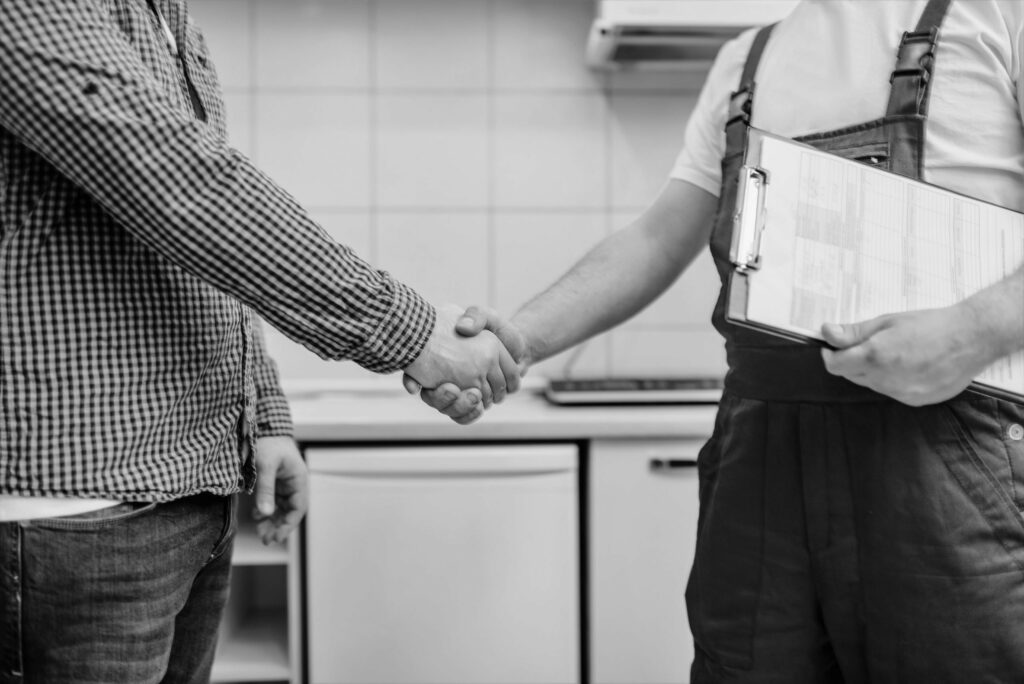 field-service-technician-and-customer-shake-hands